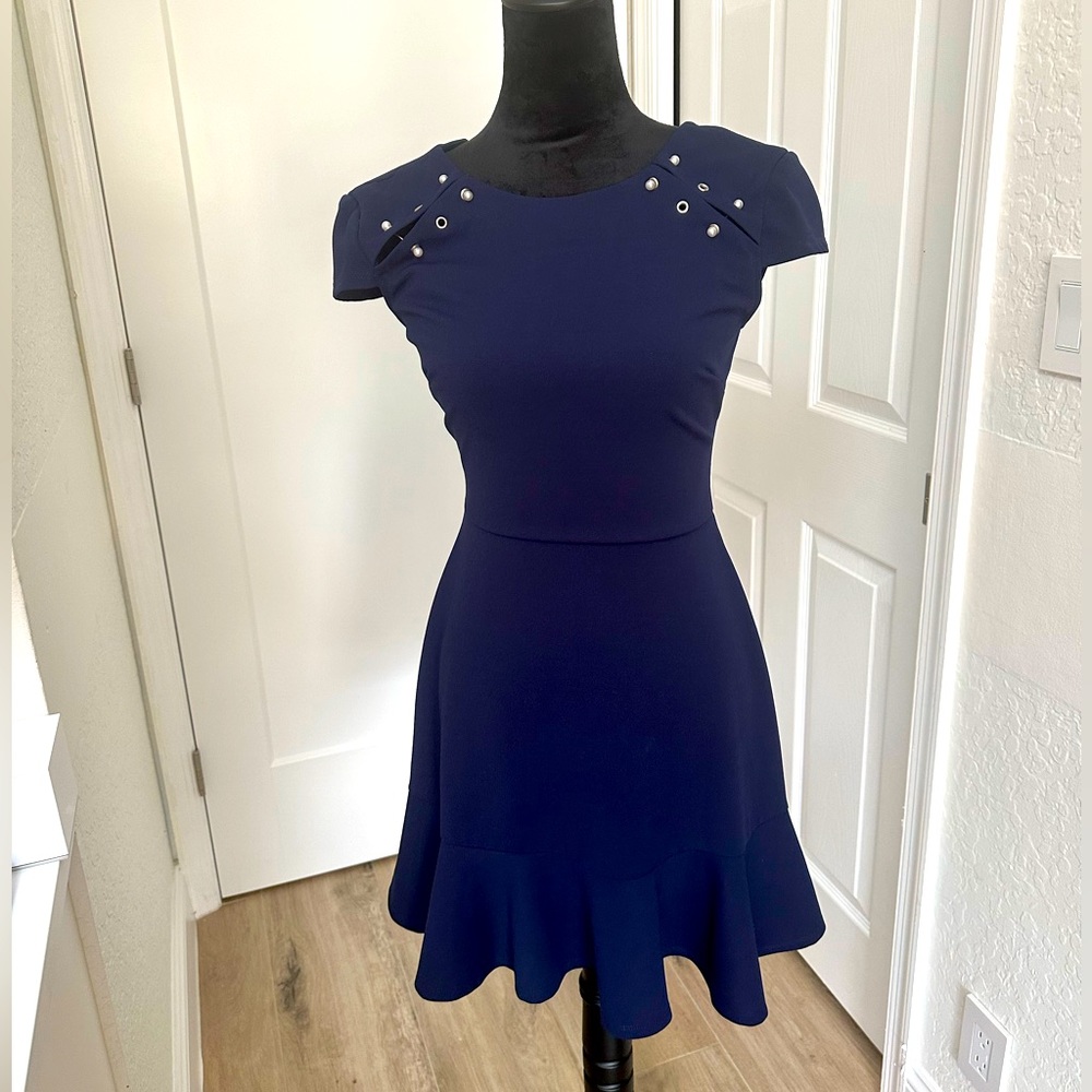 Sophisticated edge to this cap-sleeve dress from City Studios